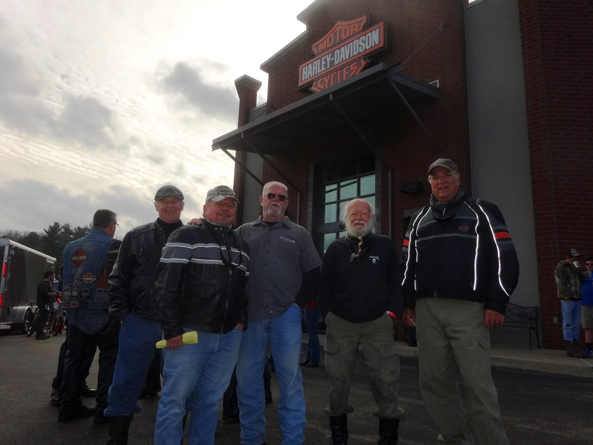 several men front the shop Harley-Davidson®